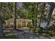 Charming single-story home surrounded by mature trees and lush landscaping at 626 Pearl Rd, Winter Springs, FL 32708