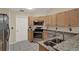 Well-equipped kitchen boasting granite countertops and stainless steel appliances at 626 Pearl Rd, Winter Springs, FL 32708