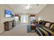 Inviting living room with plush seating, ceiling fan, and bright natural light at 626 Pearl Rd, Winter Springs, FL 32708
