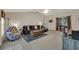Spacious living room featuring neutral tones, plush sofa, and decorative rug at 626 Pearl Rd, Winter Springs, FL 32708