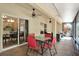Enclosed brick patio with ceiling fans and access to indoor kitchen and dining spaces at 626 Pearl Rd, Winter Springs, FL 32708