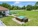 Well-maintained backyard featuring a hot tub, patio area, and plenty of green space for outdoor activities at 7065 Branch Court, St Cloud, FL 34771