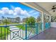 Balcony overlooking the front yard offers views of lush landscaping at 7065 Branch Court, St Cloud, FL 34771