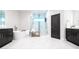 Modern bathroom featuring a soaking tub, glass shower, and dual vanity sinks at 7065 Branch Court, St Cloud, FL 34771