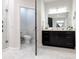 Stylish bathroom showcasing a glass-enclosed shower, single vanity, and elegant tile flooring at 7065 Branch Court, St Cloud, FL 34771