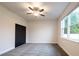 Neutral bedroom with a ceiling fan, plush carpet, and a view from the window at 7065 Branch Court, St Cloud, FL 34771