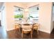 Cozy breakfast nook with charming decor, inviting natural light for a delightful dining experience at 7065 Branch Court, St Cloud, FL 34771