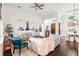 Bright living room with an open layout featuring comfortable seating, decor, and easy access to other living areas at 7065 Branch Court, St Cloud, FL 34771