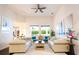 Airy living room with stylish furnishings, a cozy rug, and ample natural light, creating a welcoming atmosphere at 7065 Branch Court, St Cloud, FL 34771