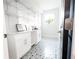 Mud room with custom shelving, decorative tile flooring, and natural light at 7065 Branch Court, St Cloud, FL 34771