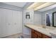 Bright bathroom features dual closets, vanity area, and neutral flooring at 7858 Sugar View Ct # 7858, Orlando, FL 32819