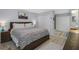Comfortable bedroom with a Southwestern-style blanket, wood furniture, and carpeted flooring at 7858 Sugar View Ct # 7858, Orlando, FL 32819