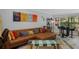 Comfortable living room with decorative pillows, unique travel-themed wall art, and modern furnishings at 7858 Sugar View Ct # 7858, Orlando, FL 32819