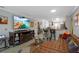 Spacious living room featuring a stylish sofa, mounted TV, and modern decor with breakfast bar at 7858 Sugar View Ct # 7858, Orlando, FL 32819