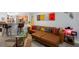 Open-concept living room featuring a leather sofa, stylish decor, and an adjacent breakfast bar at 7858 Sugar View Ct # 7858, Orlando, FL 32819
