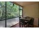 The screened patio offers serene views of the wooded outdoors at 7858 Sugar View Ct # 7858, Orlando, FL 32819