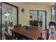 The screened lanai features an outdoor dining area and grill with peaceful views at 7858 Sugar View Ct # 7858, Orlando, FL 32819