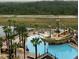 Aerial view of a pirate-themed pool area at a resort with lounge chairs and palm trees at 8125 Resort Village Dr # 5808, Orlando, FL 32821