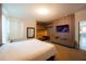 Spacious bedroom boasts a built-in media center, desk area and large window for natural lighting at 8137 Pond Apple Dr, Winter Garden, FL 34787