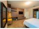 Bright bedroom featuring a built-in desk, shelving unit and a plush king-size bed with carpeted floors at 8137 Pond Apple Dr, Winter Garden, FL 34787