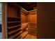 Custom walk-in closet with built-in shelves, drawers, and modern lighting for organized storage at 8137 Pond Apple Dr, Winter Garden, FL 34787