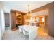 Open-concept dining room with sleek furnishings and modern decor adjacent to the kitchen at 8137 Pond Apple Dr, Winter Garden, FL 34787