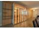 Modern dining room offers wood-look tile floors, a wine cabinet, and contemporary design at 8137 Pond Apple Dr, Winter Garden, FL 34787