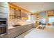 Modern kitchen with sleek cabinets, stainless steel appliances, marble backsplash, and quartz countertops at 8137 Pond Apple Dr, Winter Garden, FL 34787