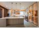 This modern kitchen features stainless steel appliances, custom cabinets, and a kitchen island at 8137 Pond Apple Dr, Winter Garden, FL 34787