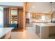 Bright, modern kitchen with custom cabinets, an island, and stainless steel appliances at 8137 Pond Apple Dr, Winter Garden, FL 34787