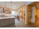 This modern kitchen features stainless steel appliances, custom cabinets, and a kitchen island at 8137 Pond Apple Dr, Winter Garden, FL 34787