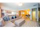 Open-concept living space showcasing kitchen, dining area, and a comfortable lounge area at 8137 Pond Apple Dr, Winter Garden, FL 34787