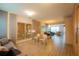 Spacious living area features tile floors, stylish decor, and a view into the dining area at 8137 Pond Apple Dr, Winter Garden, FL 34787