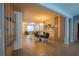 Open-concept living and dining area features tile floors, a modern table set and stylish decor at 8137 Pond Apple Dr, Winter Garden, FL 34787