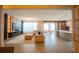 Open-concept living area features modern design, fireplace, and seamless flow to kitchen and dining at 8137 Pond Apple Dr, Winter Garden, FL 34787