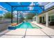 Beautiful screened-in pool area featuring ample seating, pavers and a tranquil, resort-like atmosphere at 8137 Pond Apple Dr, Winter Garden, FL 34787
