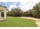 Expansive backyard featuring lush green grass and mature trees at 8258 Sw 136Th Ter, Dunnellon, FL 34432