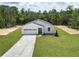 A charming single-Gathering home with a well-manicured lawn, attached garage, and bright curb appeal at 8258 Sw 136Th Ter, Dunnellon, FL 34432