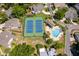 Aerial view of community amenities with tennis courts and a pool for residents at 849 Millrace Pt, Longwood, FL 32750