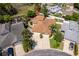 Aerial view showcasing the home's roof, driveway, and lush landscaping at 849 Millrace Pt, Longwood, FL 32750