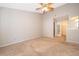 Spacious bedroom with carpet and access to a walk-in closet at 849 Millrace Pt, Longwood, FL 32750