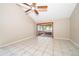 Bedroom with light tile flooring, ceiling fan, and sliding glass doors to a patio at 849 Millrace Pt, Longwood, FL 32750