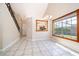 Open interior space features a large window, stairs, and a clear view of the modern kitchen at 849 Millrace Pt, Longwood, FL 32750