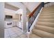 Inviting interior showcases staircase, tile flooring, and an open-concept layout flowing into kitchen at 849 Millrace Pt, Longwood, FL 32750