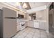 Bright kitchen featuring white appliances and plenty of cabinet storage space at 849 Millrace Pt, Longwood, FL 32750