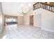 Bright, spacious living room with sliding glass doors and vaulted ceilings perfect for entertaining at 849 Millrace Pt, Longwood, FL 32750