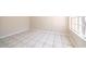 Bright living room with tile flooring and natural light streaming through the large window at 849 Millrace Pt, Longwood, FL 32750
