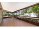 Large screened porch with tile flooring and views of the backyard at 849 Millrace Pt, Longwood, FL 32750