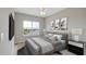 Comfortable bedroom with a ceiling fan, large window, and well appointed decor at 8560 Magnificent Ln, Groveland, FL 34736