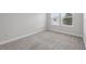 Bright bedroom featuring neutral carpet, fresh white walls, and a double window at 9389 Meadow Hunt Way, Winter Garden, FL 34787